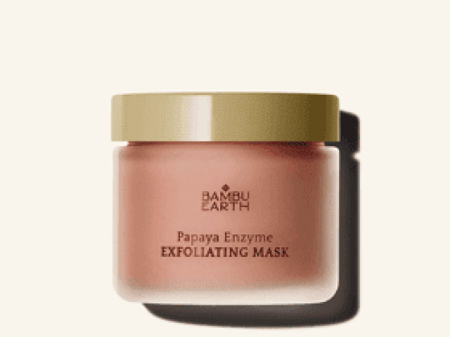 Photograph of Bamboo Earth Papaya Enzyme Exfoliating Mask jar with gold lid on cream background.