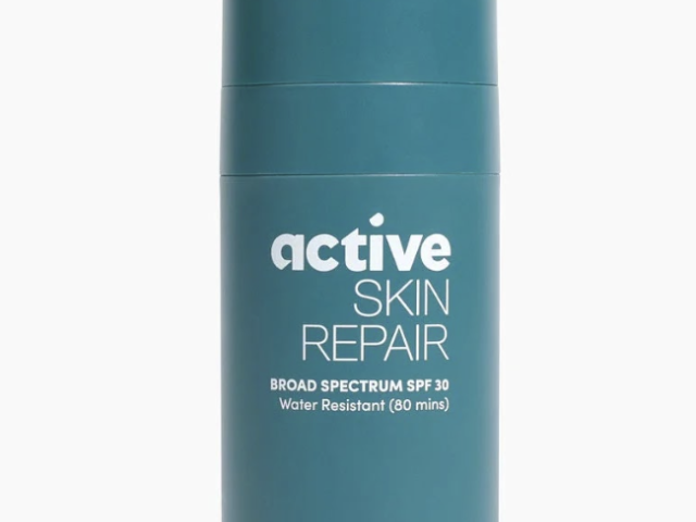 Photograph: teal cylindrical sunscreen bottle labeled Active Skin Repair, SPF 30