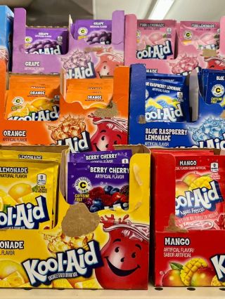 Photograph of colorful Kool-Aid packets and boxes on a store shelf