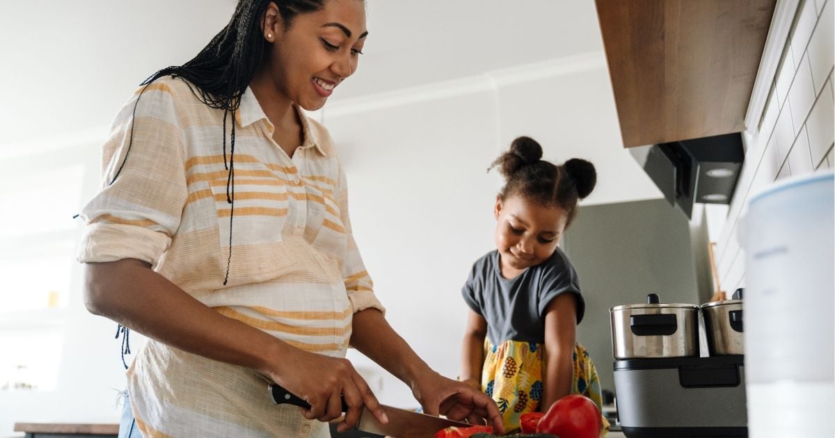 Pregnant woman preparing veggies