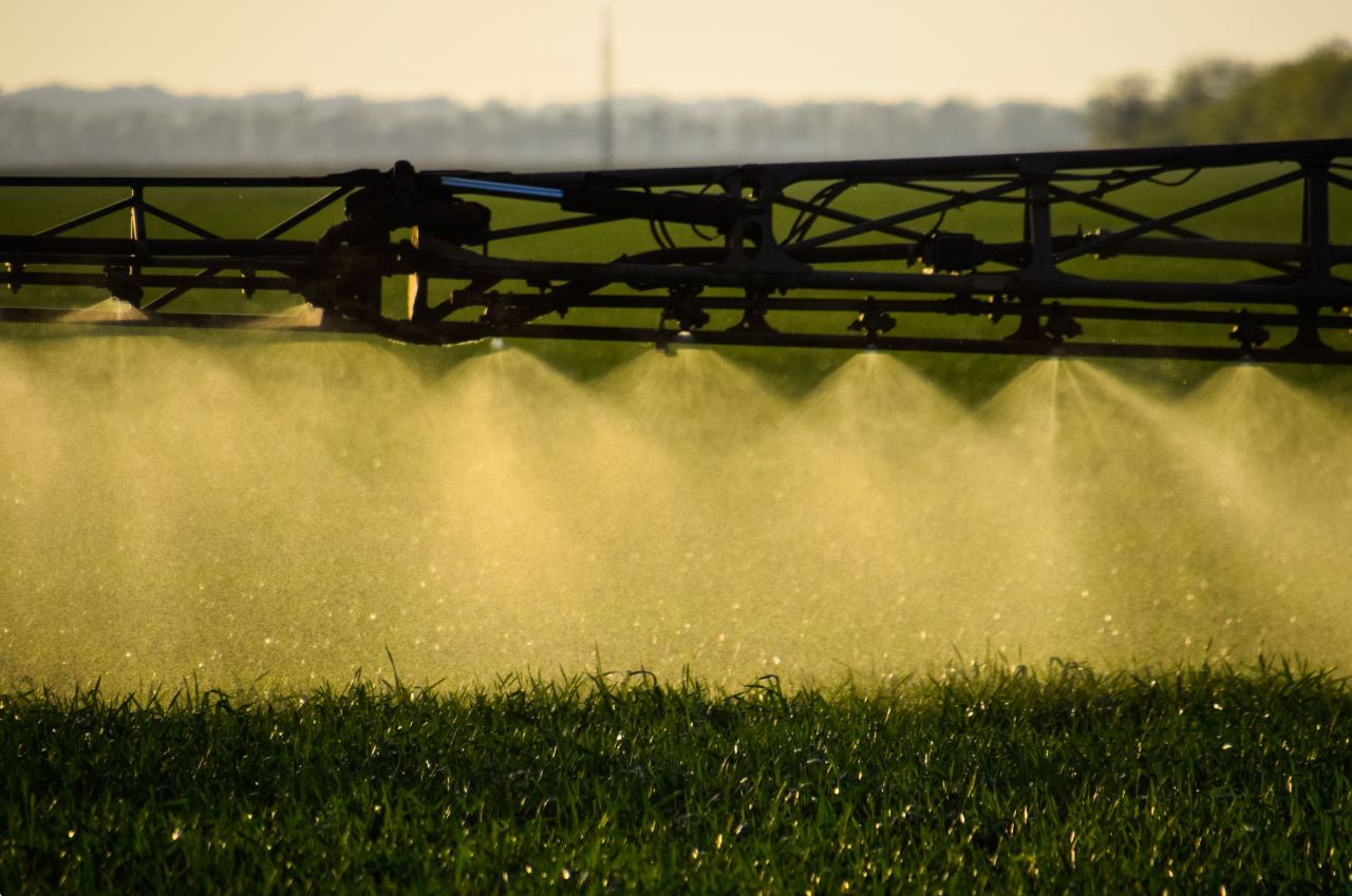 Fertilizer being sprayed on a crop.