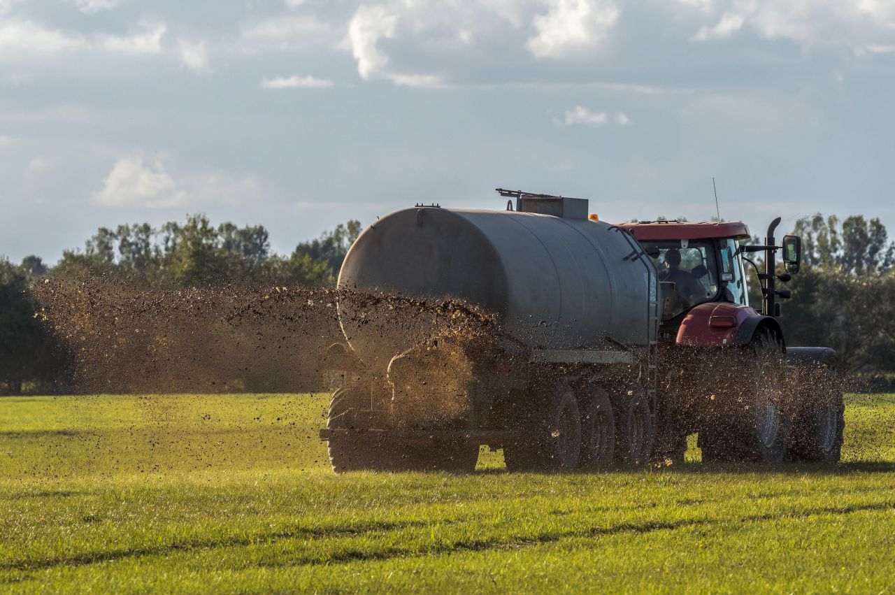 Manure being sprayed on a farm field.