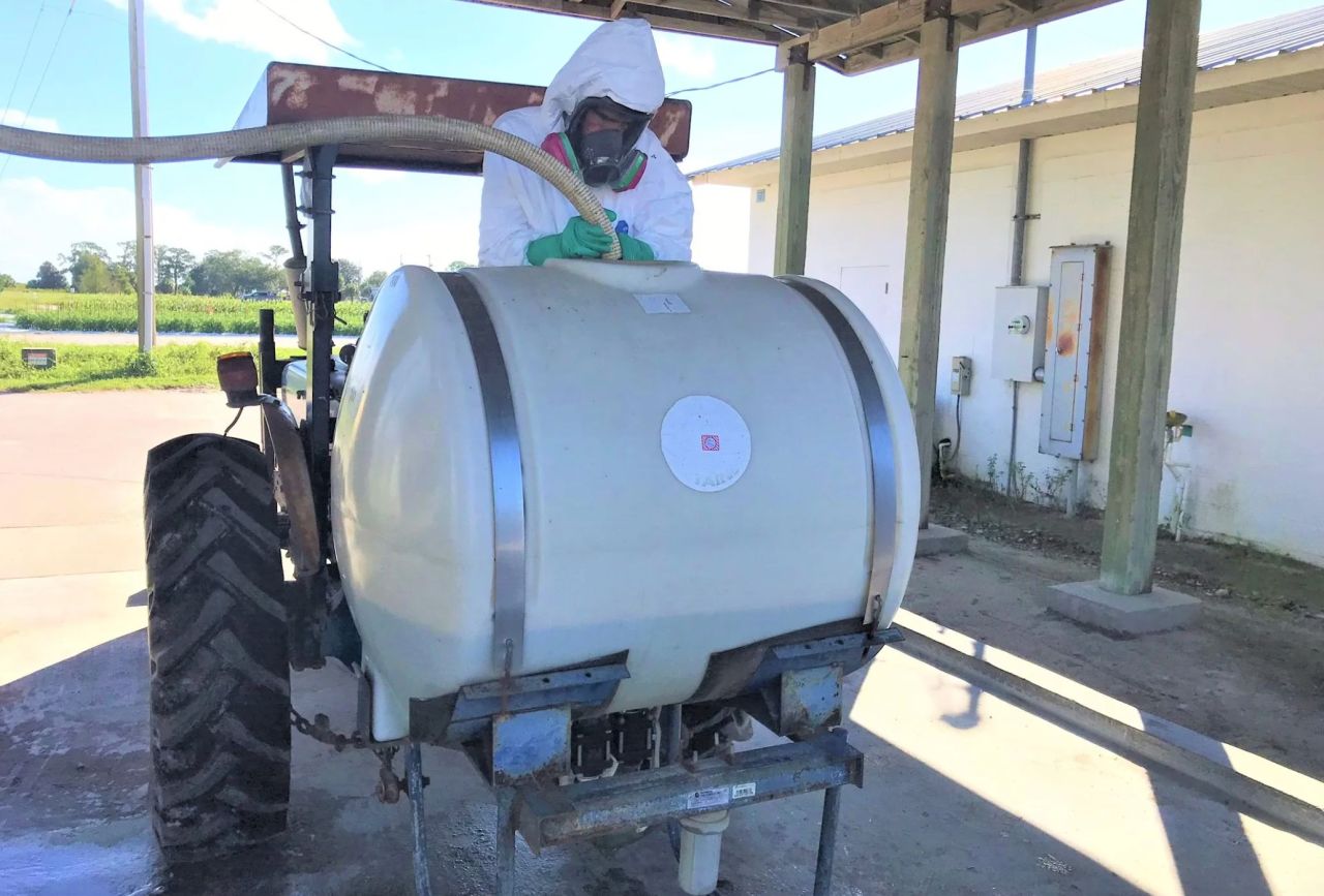 Person loading paraquat