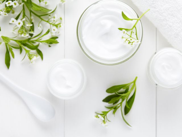 Cosmetic cream and herbal flowers
