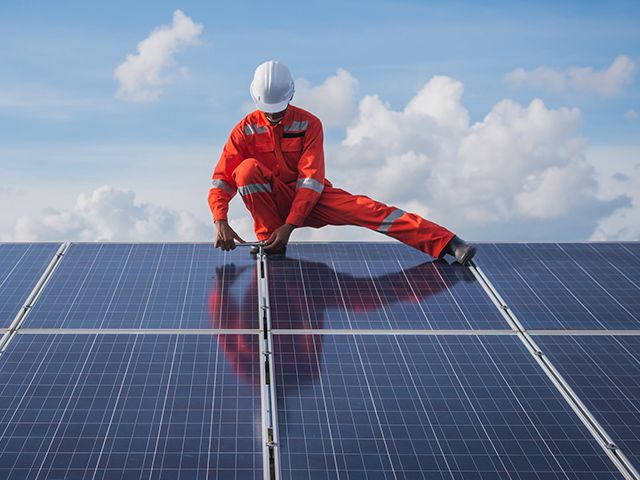 Person installing solar panels