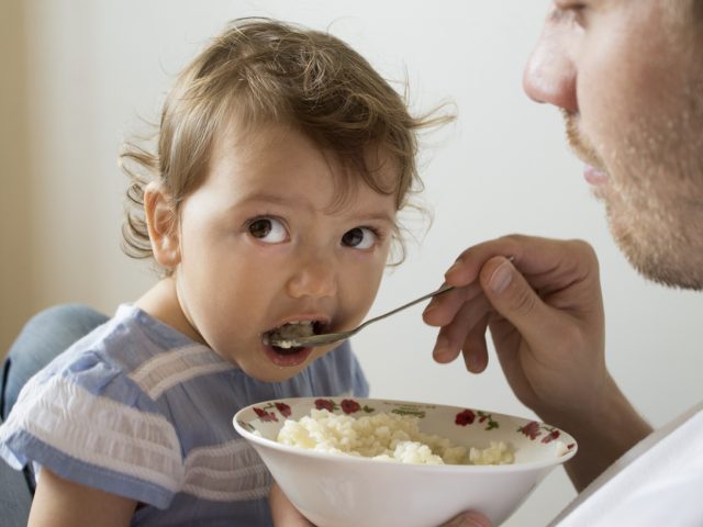 Baby eating rice porridge