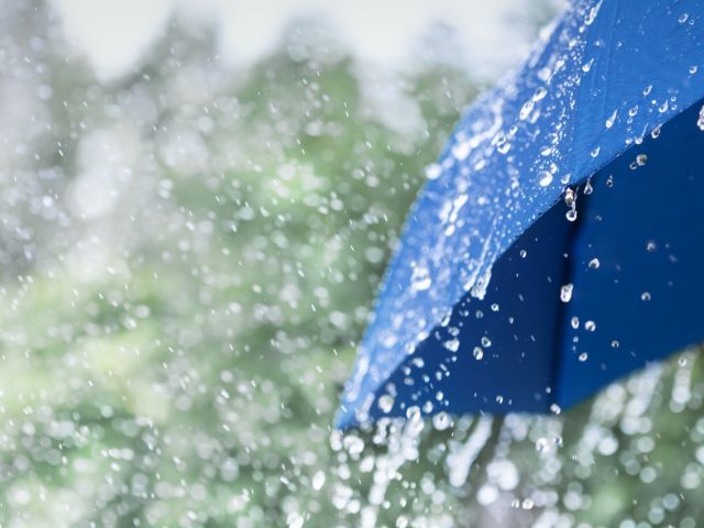 Umbrealla being hit by rain