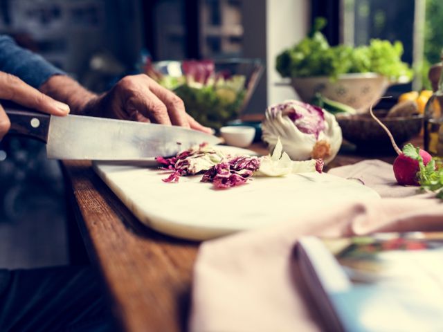 Person cutting radicchio