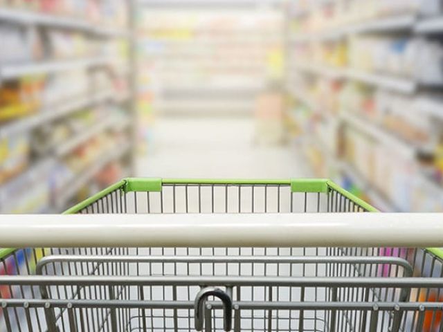 Viewpoint from a shopping cart down a grocery store aisle