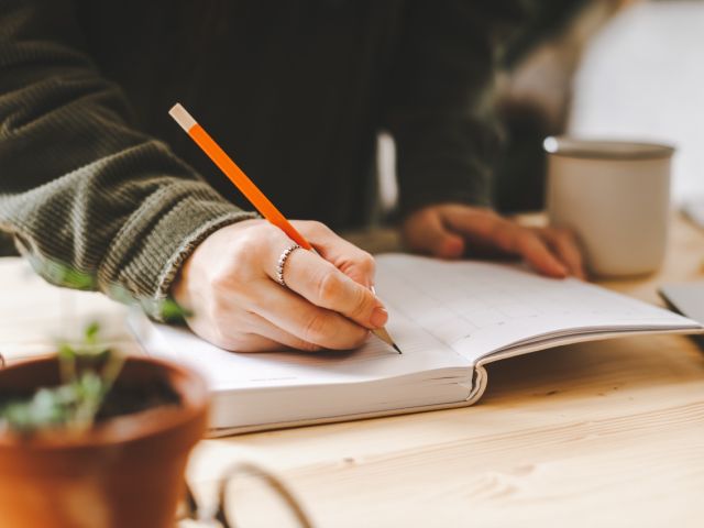 Person writing in a journal