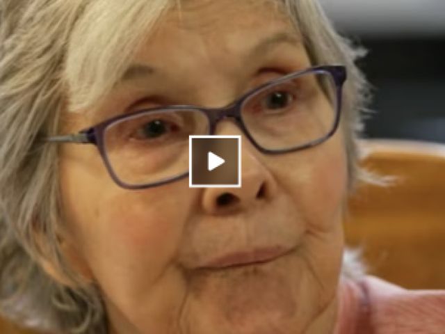 Older woman looking at camera