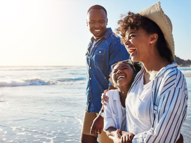 Family walking together on beach