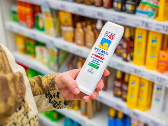 Person looking at an international sunscreen