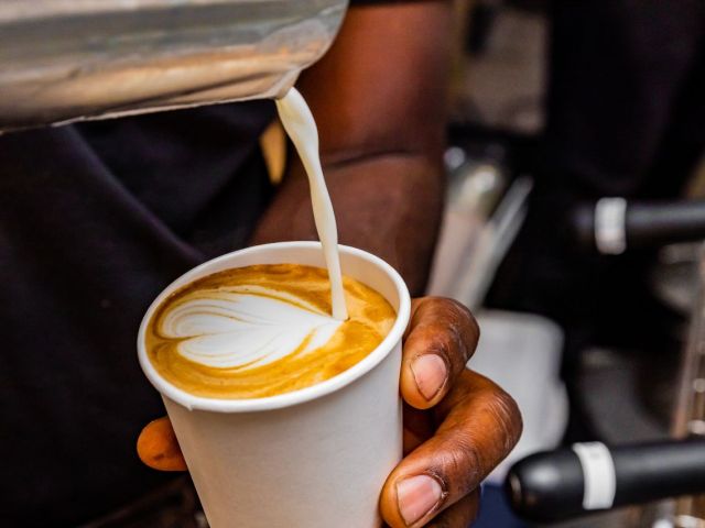 Person making a latte