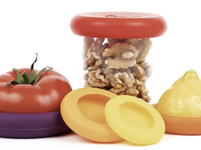 Colorful toy food items including a tomato, lemon, and purple and yellow containers.