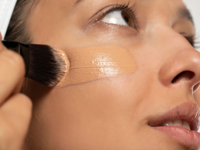 Woman applying foundation