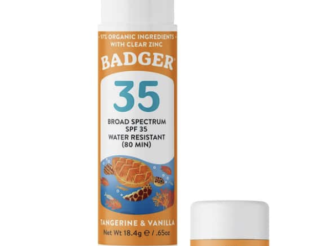 Sunscreen sticks in a tube and small container, labeled "Badger" and "Kids Sunscreen."