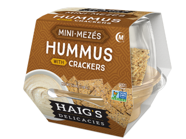 Hummus and crackers snack package featuring a clear container and branded label.