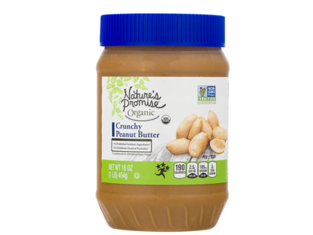 Jar of Nature's Promise organic crunchy peanut butter with a blue lid.
