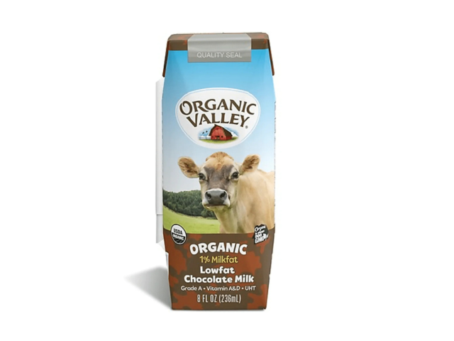 Carton of Organic Valley low-fat chocolate milk featuring a cow and a countryside backdrop.
