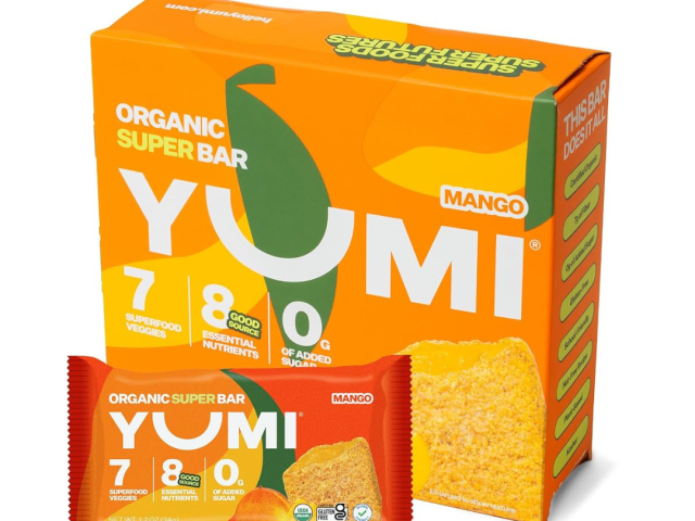 Yellow and orange packaging of Yumi organic super bar, mango flavor, with a bar in front.