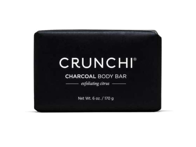 Black bar soap packaging labeled "CRUNCHI Charcoal Body Bar" with citrus scent.