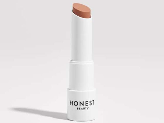 Nude lipstick in a white tube labeled "HONEST BEAUTY."