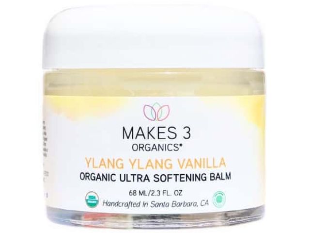 Organic Ultra Softening Balm in a clear jar labeled "Ylang Ylang Vanilla."