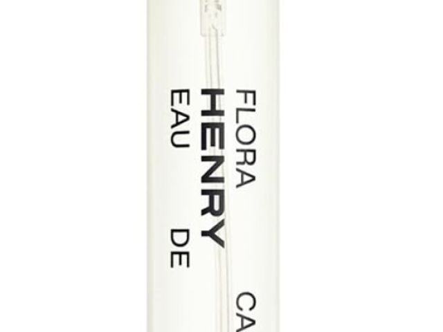 Clear glass perfume bottle with a dark cap, labeled "Flora Carnivora Henry Rose Eau de Parfum."