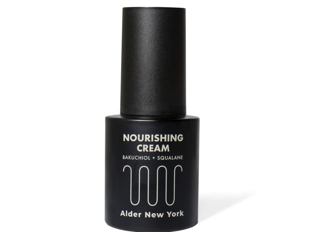 Black bottle of nourishing cream with a pump, labeled "Nourishing Cream" and "Alder New York."