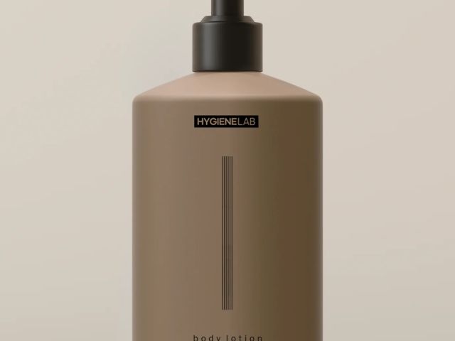 Brown pump bottle of body lotion with a minimalist design and black label.