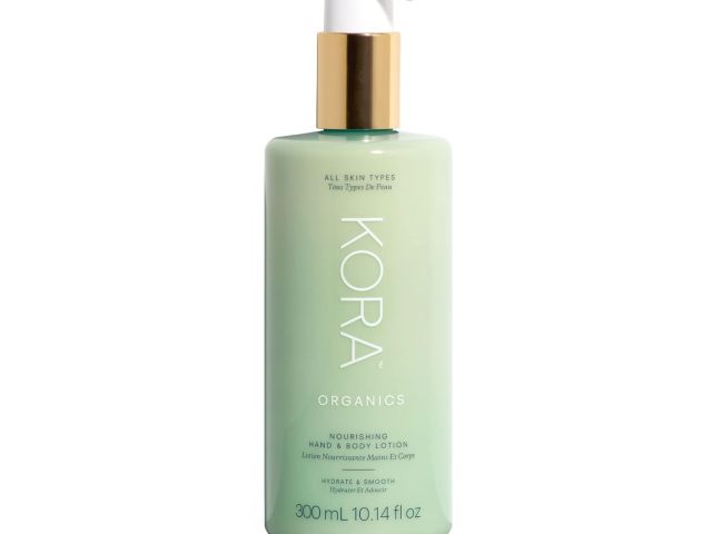 Mint green bottle of Kora Organics nourishing hand and body lotion with a pump dispenser.