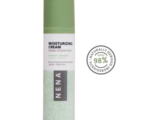 Moisturizing cream bottle with green lid, featuring natural ingredients label.
