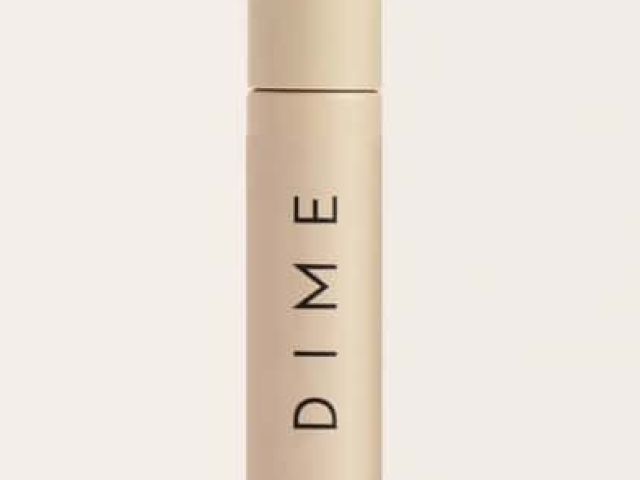 A beige tube of eyebrow enhancing gel with a minimalist design and the label "DIME."