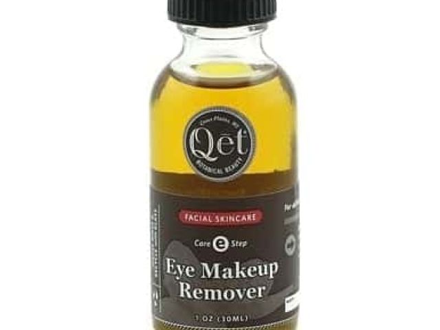 Small bottle of Qet Eye Makeup Remover with a black cap and labeled contents.