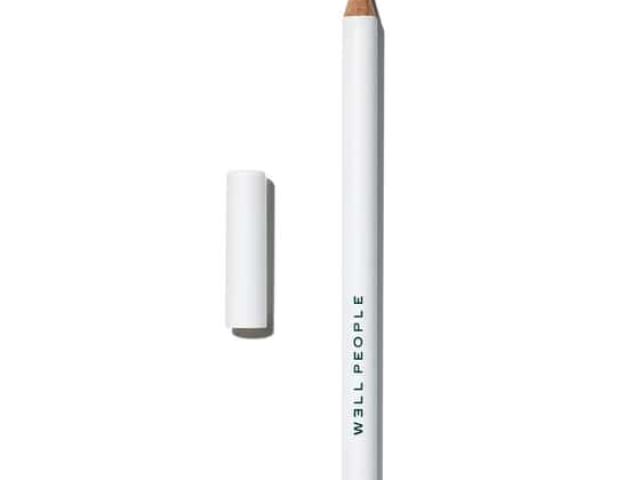 Black eyeliner pencil beside its white cap, labeled "WELL PEOPLE."