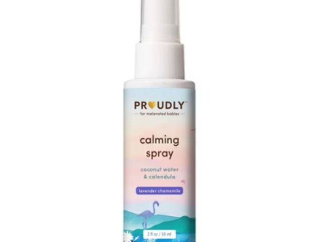 Bottle of calming spray with a pastel design, featuring coconut water and calendula.