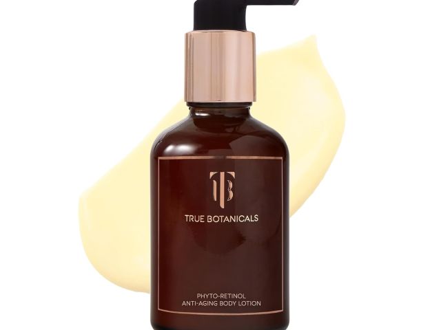 Brown bottle of True Botanicals body lotion with pump, beside a creamy lotion swatch.