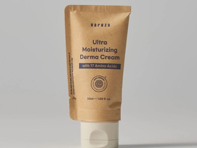 Brown tube of Ultra Moisturizing Derma Cream with a white cap and clear label details.