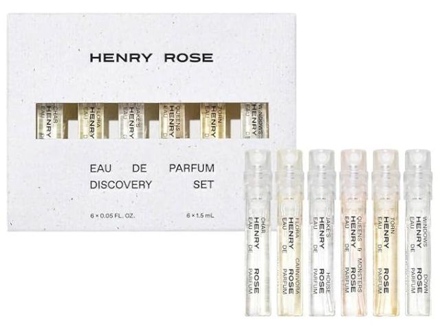 A set of six small perfume vials arranged in a box labeled "Henry Rose."