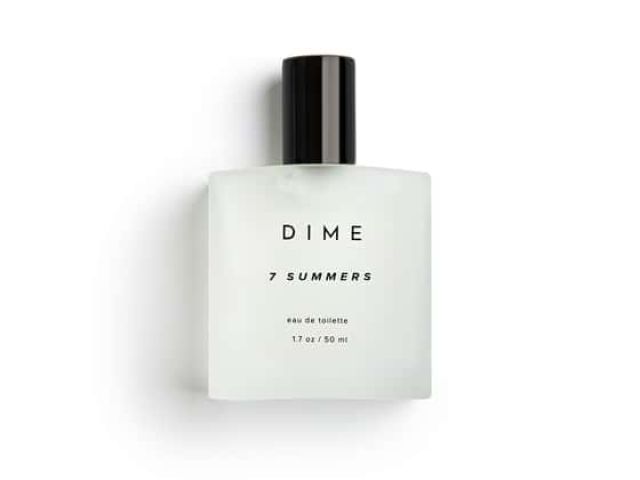 Clear glass fragrance bottle labeled "DIME 7 SUMMERS" with a black cap.