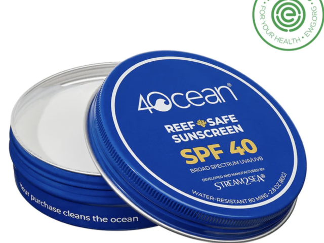 Round blue tin of 4ocean Reef Safe Sunscreen, labeled SPF 40, partially open.