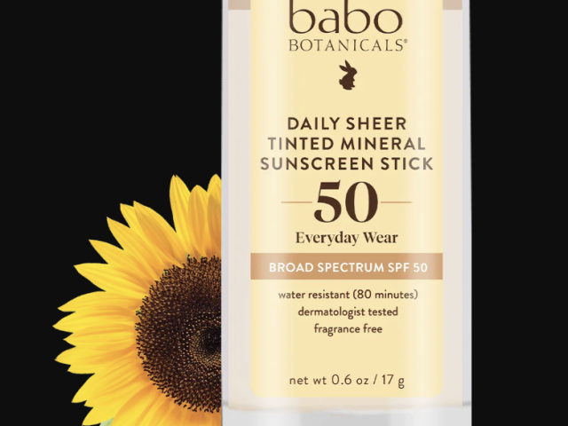 Tinted mineral sunscreen stick with SPF 50, featuring a sunflower graphic.