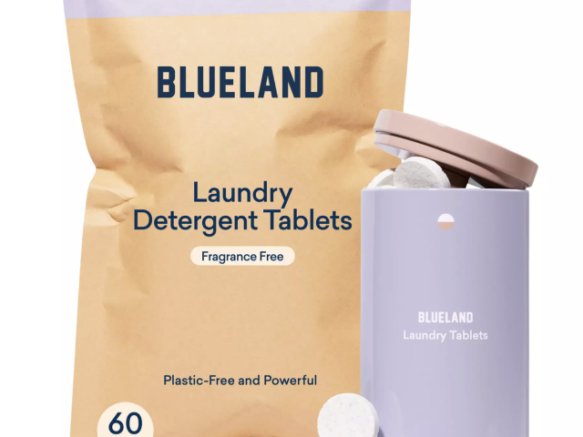 A package of Blueland laundry detergent tablets next to a lavender container holding tablets.