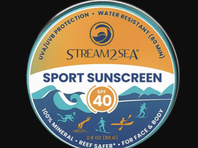 Circular container of Stream2Sea Sport Sunscreen with SPF 40, depicting ocean scenes.