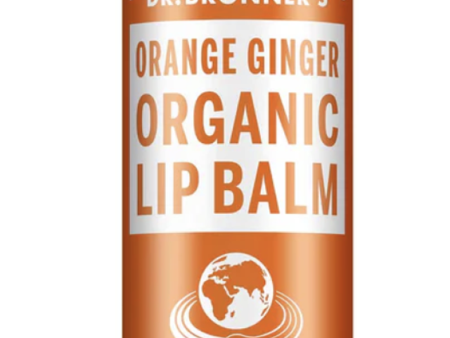 Orange and white tube of Dr. Bronner's Organic Lip Balm with orange ginger flavor.