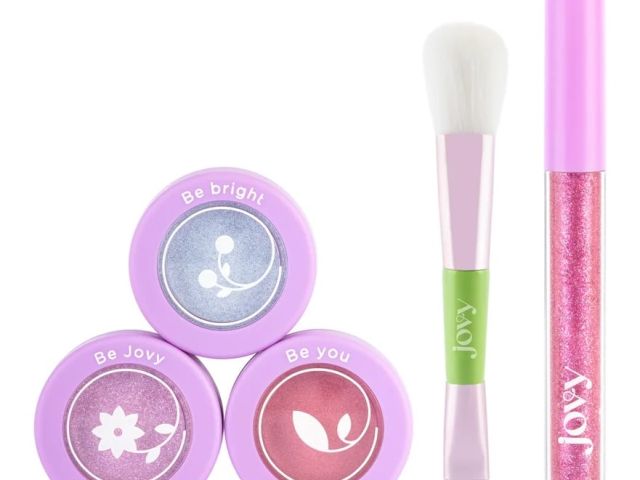 Product photo: three purple cosmetic pots, double-ended brush, and pink glitter lip gloss.