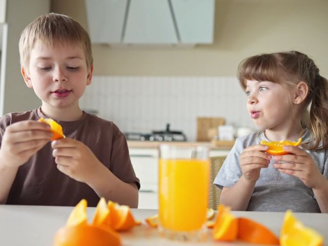 kids drinking OJ