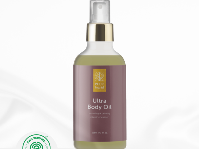 Photograph: Ultra Body Oil spray bottle with gold pump, mauve label and green eco seal