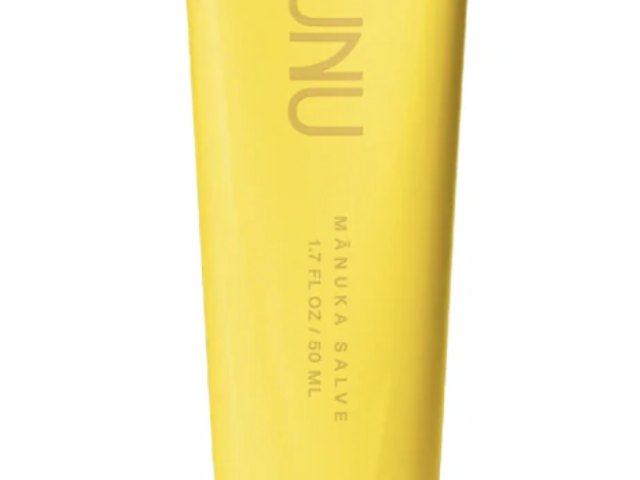 Product photograph: yellow AUNU Manuka Salve tube upright on white background